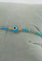 Women’s Handmade Macramé Bracelet With Light Blue Beads and Evil Eye 527277-6